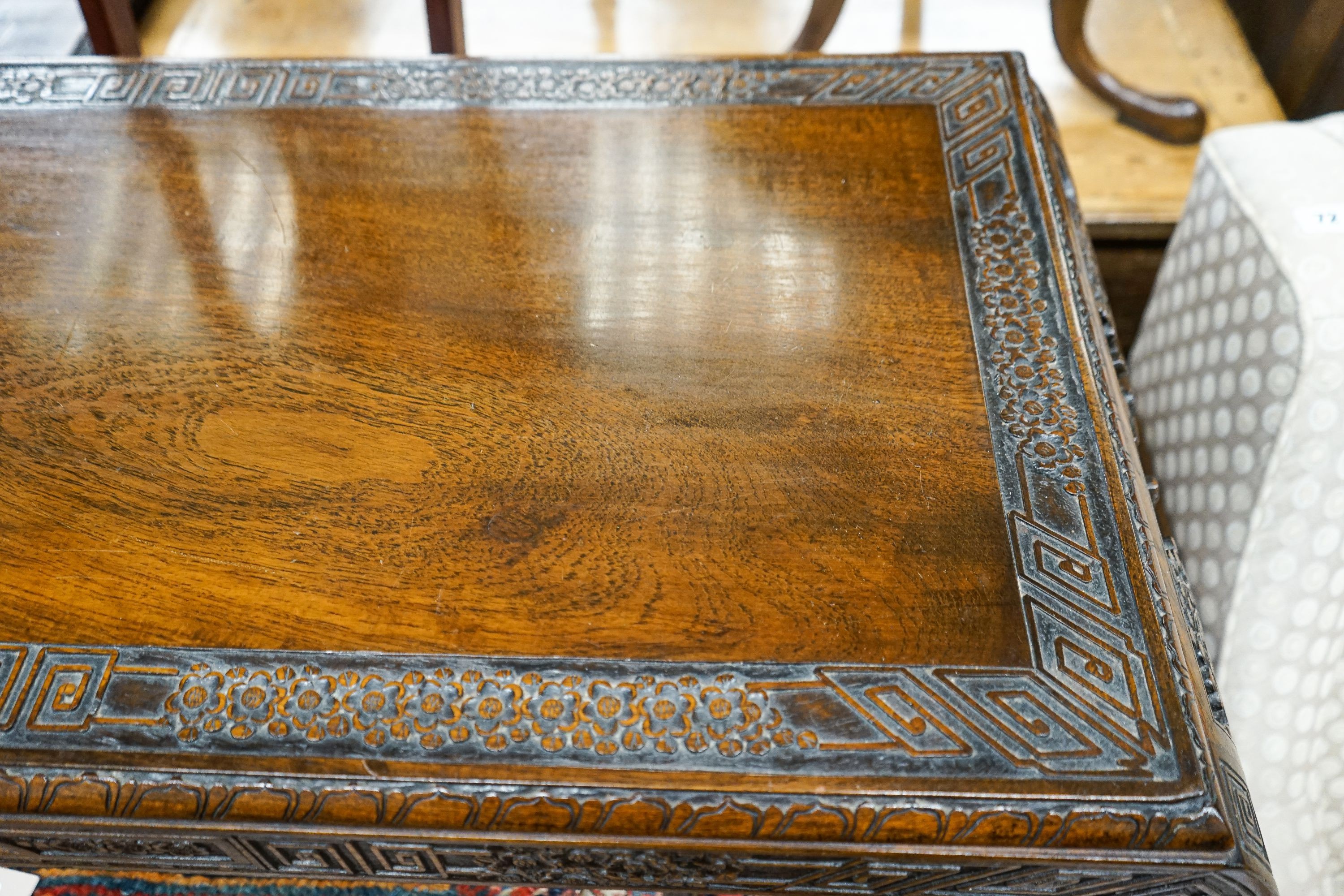 A Chinese rectangular carved top hardwood table, width 104cm, depth 46cm, height 29cm